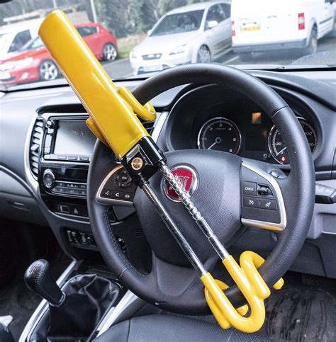 Steering wheel lock - The steering lock has a vinyl coating to protect against damage to interior fittings and constructed using tough hardened steel. Used on your steering wheel to protect against theft. Universal fit for cars, trucks, vans, and SUVs. Solid steel hooks for greater security. Made with a longer shaft for large truck and SUV applications.